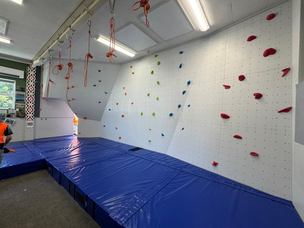 Top-rope climbing wall with belay ropes installed at a New Zealand school