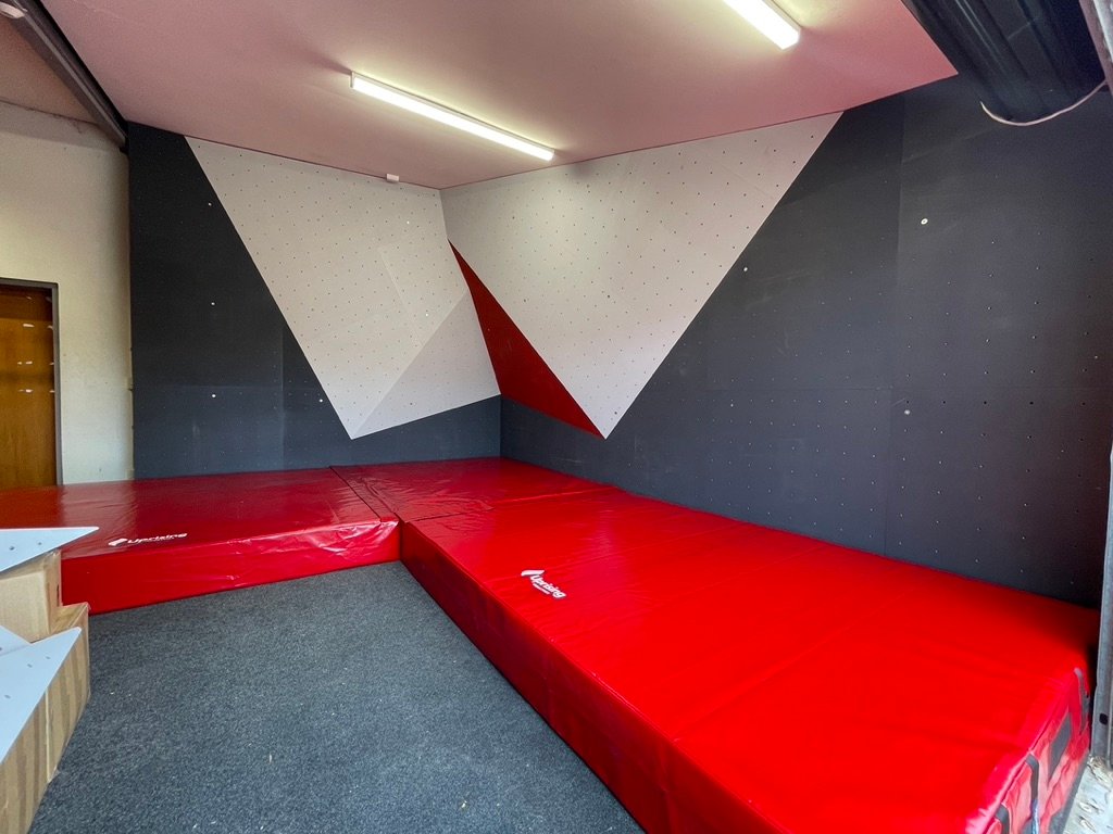 Red, black and white bouldering wall built for Shirley Boys' High School
